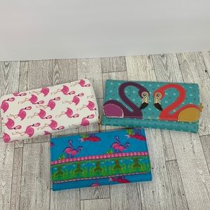 3 flamingo wallets. One is Relic. The other 2 aren’t name brand.